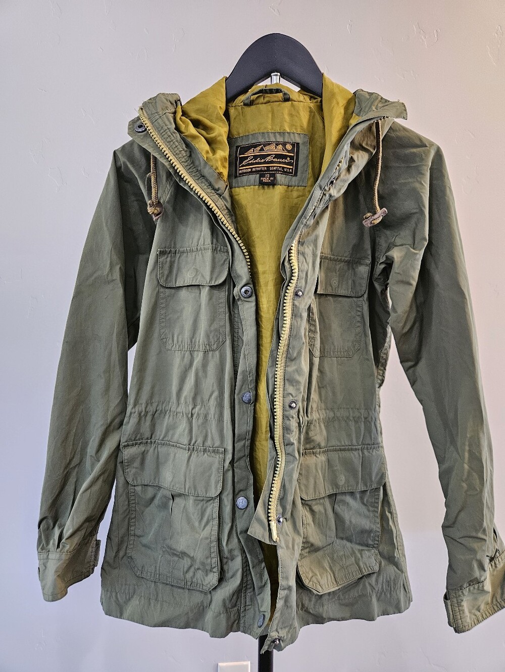 Vintage Eddie Bauer mountain parka in olive green with a mustard color lining